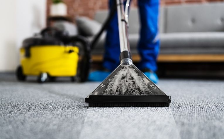 vacuuming the floor